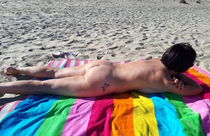 MILF likes to show herself sunbathing in public. image 10