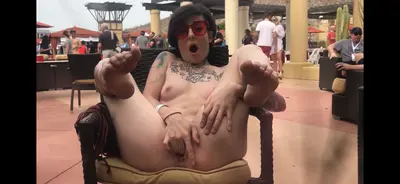 Wild exhibitionist brunette bates in public - middle of busy resort cover image