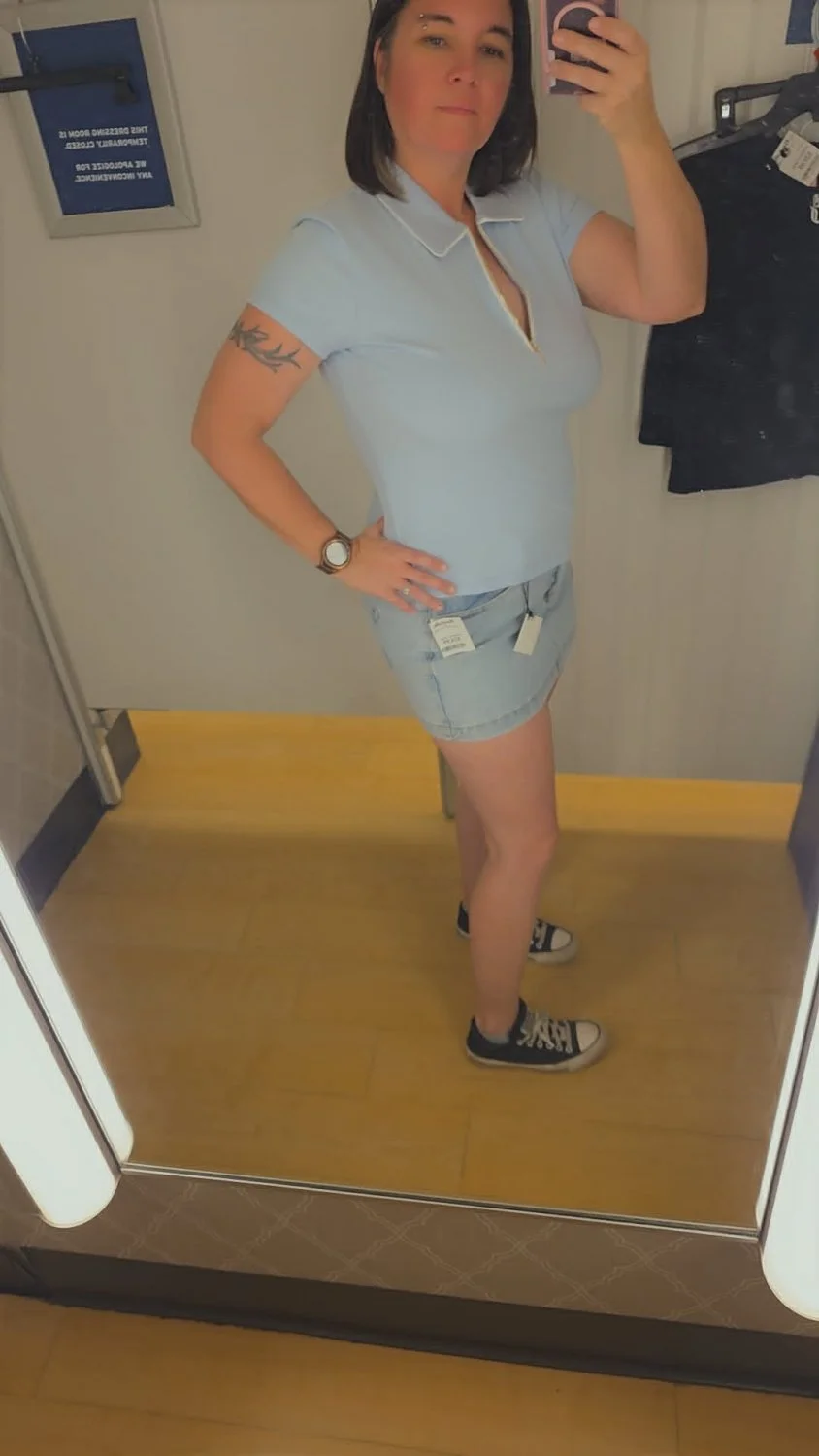My favorite milf strips in a public changing room image 3