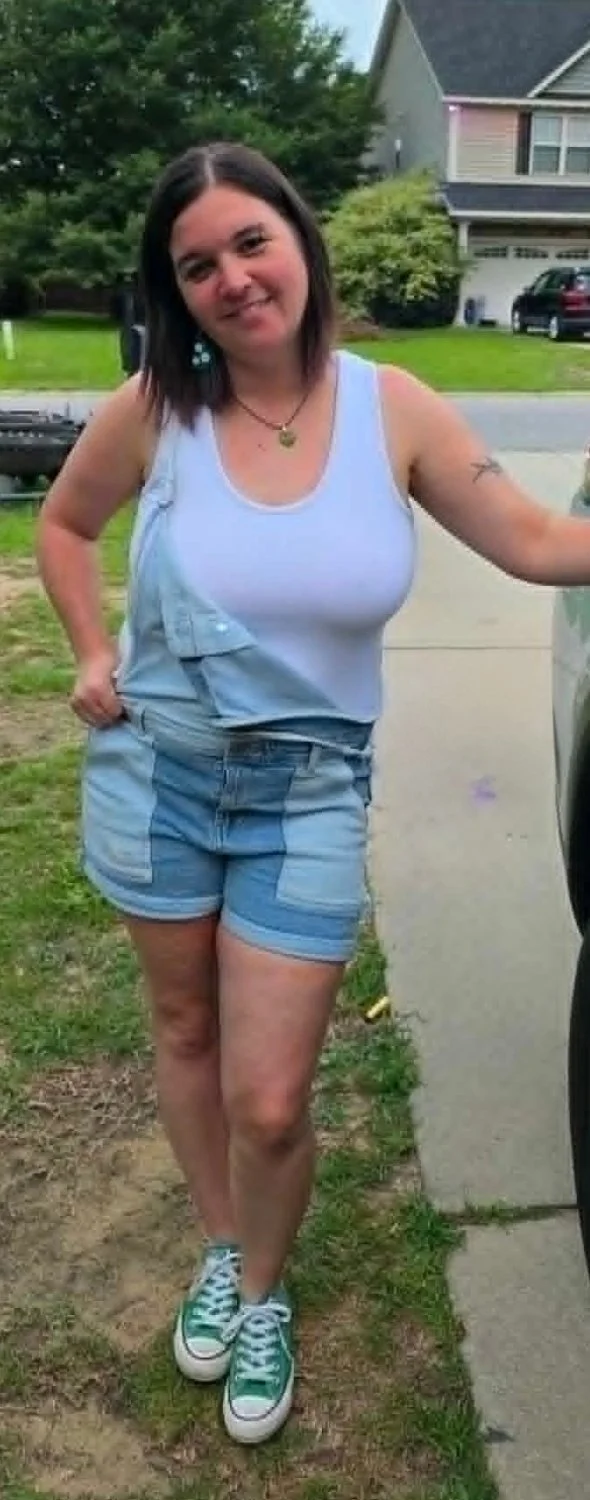 My favorite milf strips in a public changing room image 6