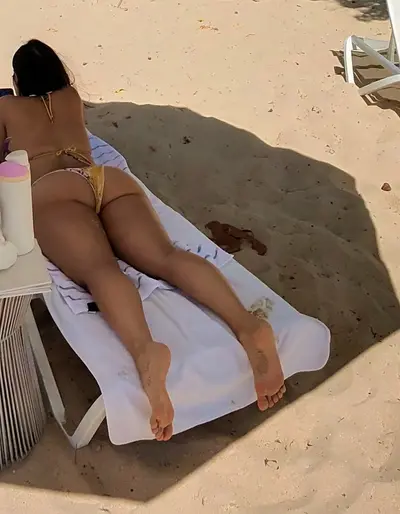 Hotwife on vacation teasing strangers on the beach cover image