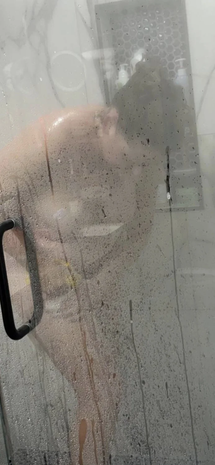Mature blonde showering image 4