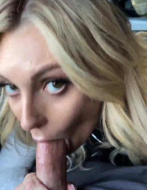 This blonde bombshell is eagerly deep-throating a throbbing cock image 1