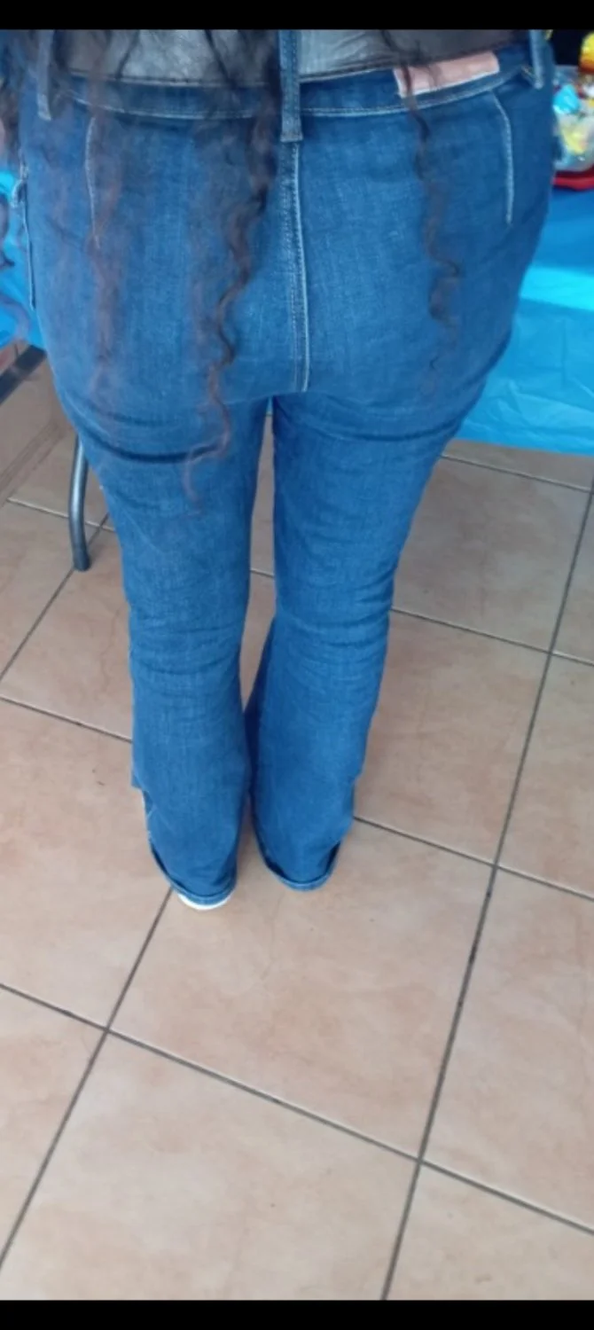 Sexy girl in perfect tight blue jeans with best ass main image