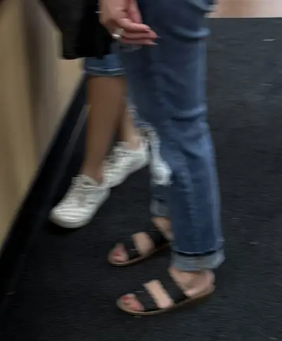 Women’s red toes wearing her sandals cover image