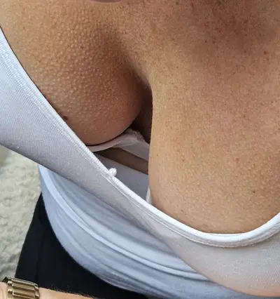 My wife's 36c tits in a bikini cover image