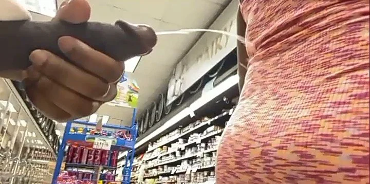 Cums on a stranger's ass in the store image 2