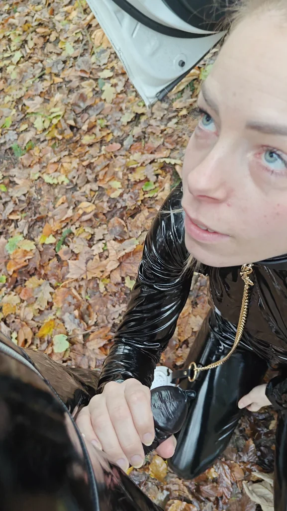 My slave sucking im public in PVC image 5