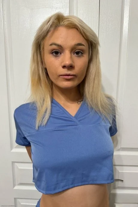 Slim blonde nurse Ellie main image