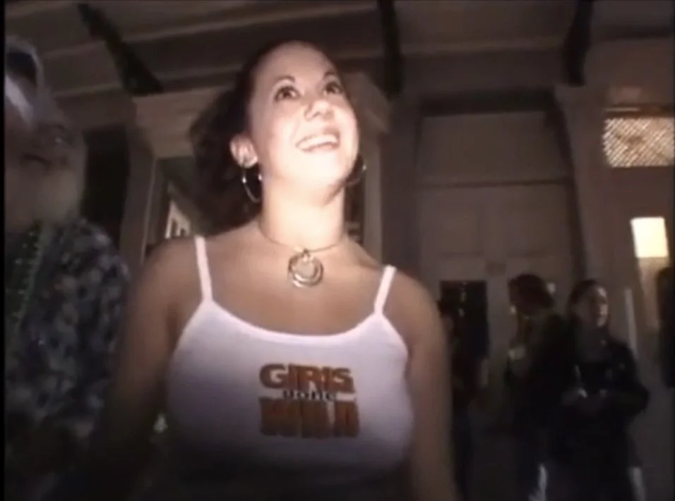 Military wife Jacquelyn blushes as she shows off her awesome tits for a crappy shirt in public image 2