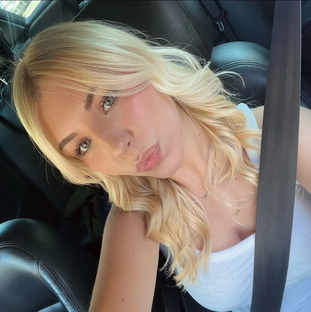 Sexy blondie teen in the car main image