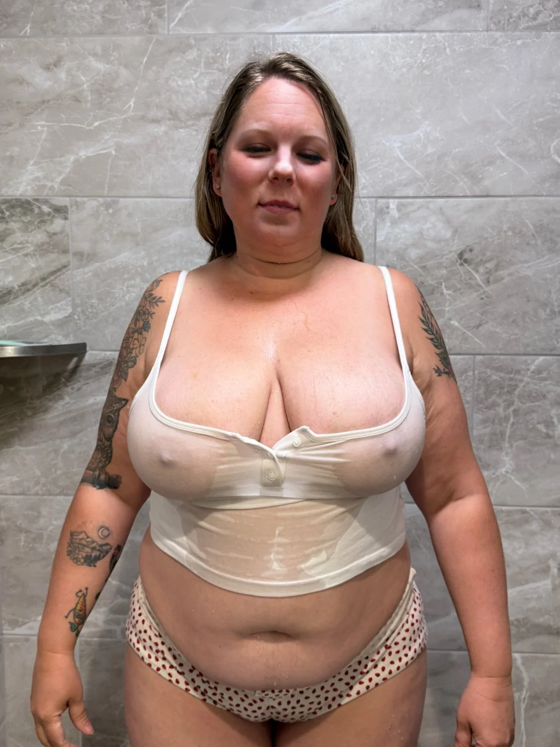Amanda showing off her piss soaked big tits image 13