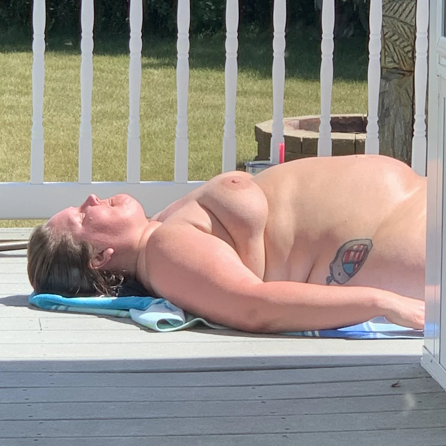 Mom sunbathing when dad is gone image 14