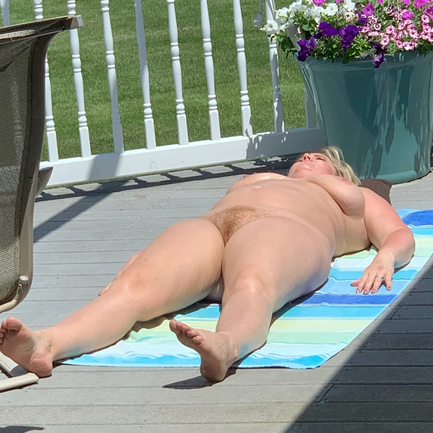 Mom sunbathing when dad is gone image 3