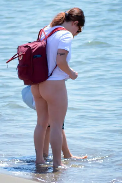 flashing ass on the beach... cover image