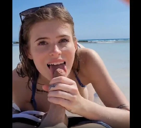 hot brunette gives head at the beach image 3