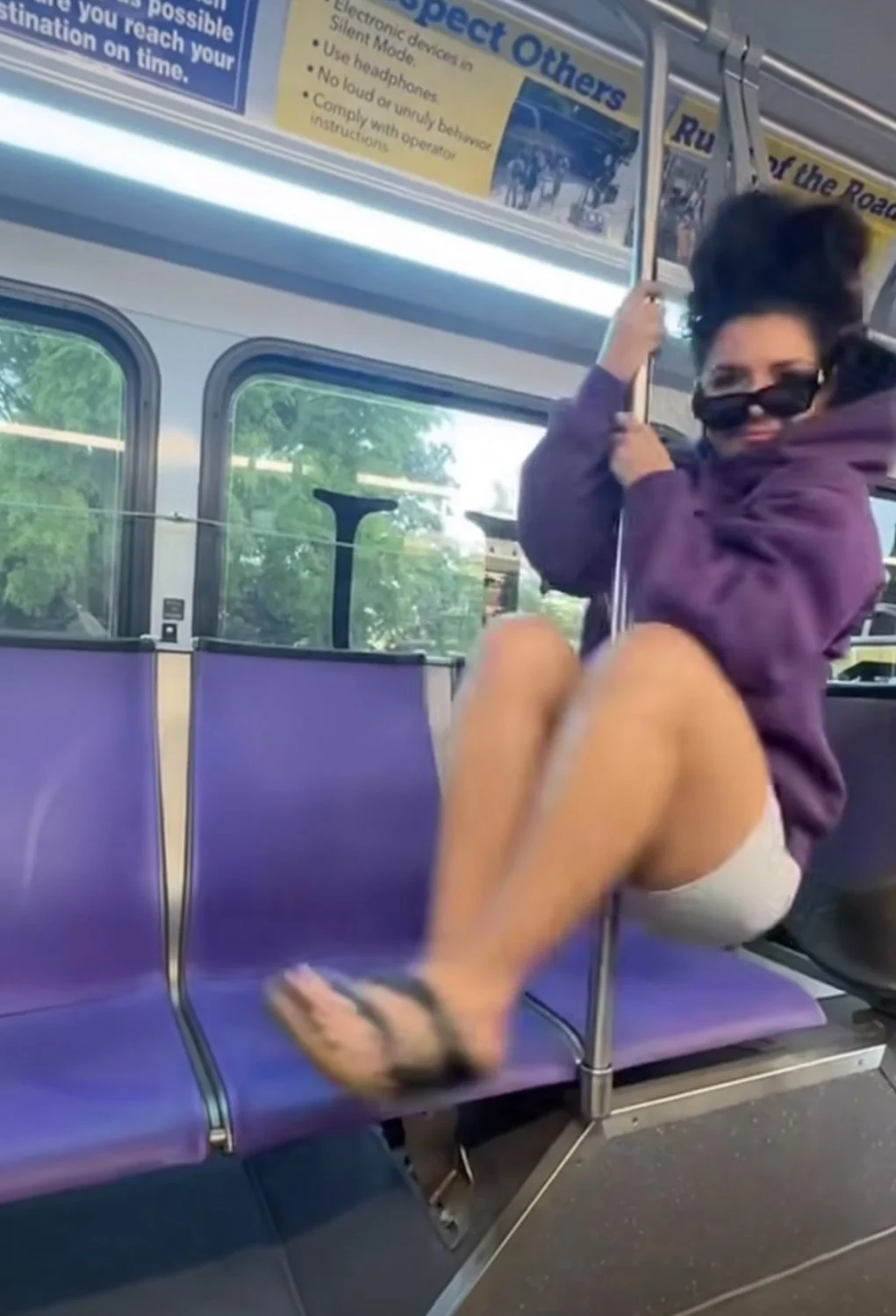 Sexy Mexican girl at public transportation on the pole main image