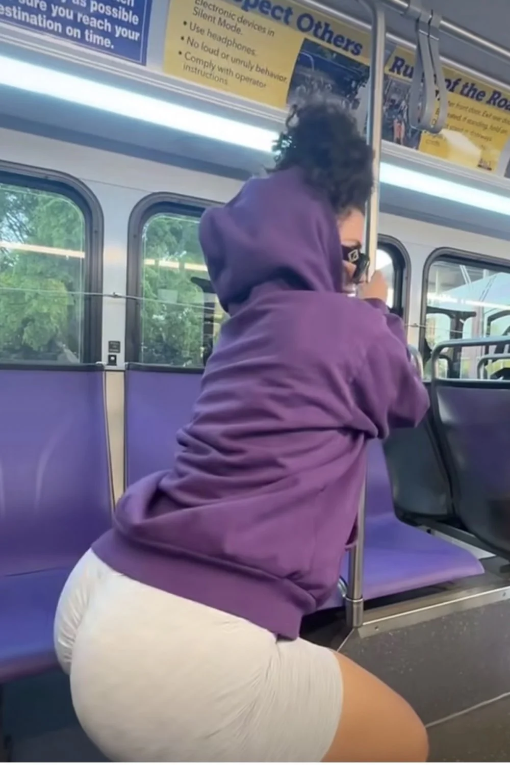 Sexy Mexican girl at public transportation on the pole image 2