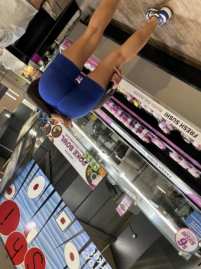 Blonde college slut shows off blue shorts cover image