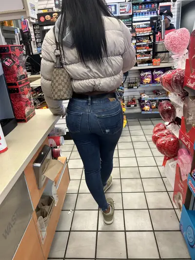 Booty poking out in jeans cover image