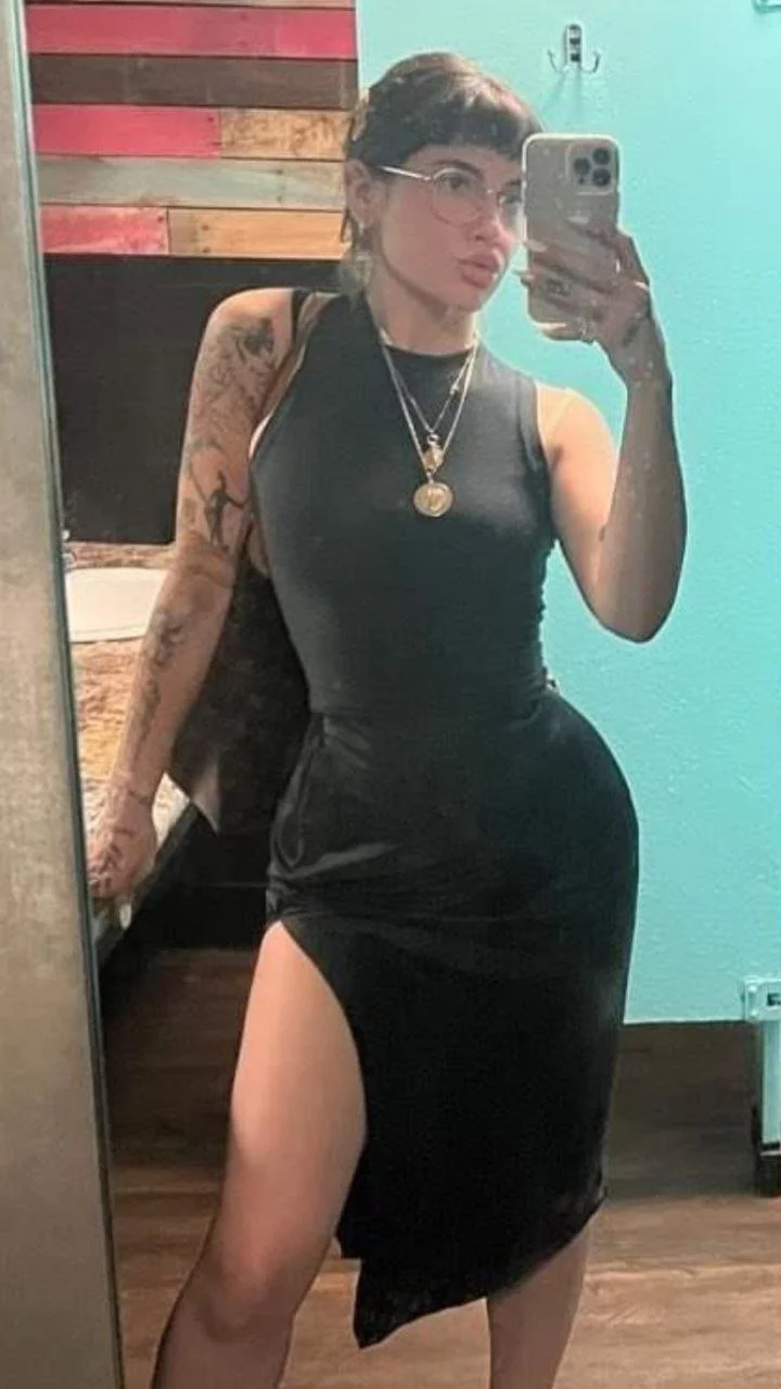 Smoking hot slut showing off her assets! image 4