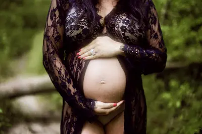 Beautiful brunette Mommy on deck boudoir cover image