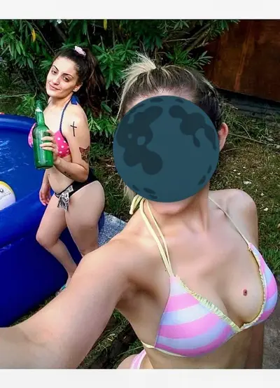 Teen cutie shows off her tits cover image