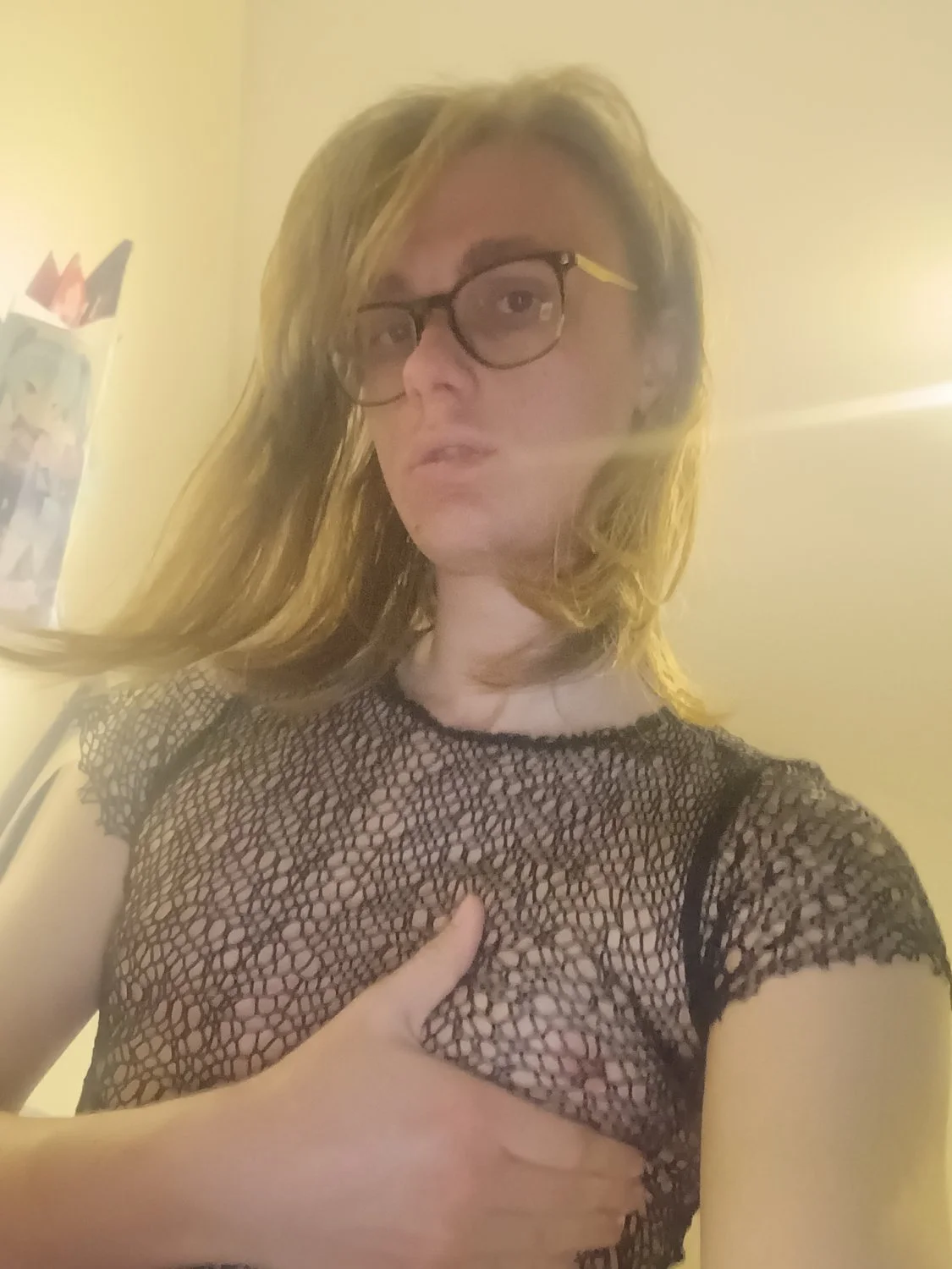 Dutch Kate sucks dildo in fishnet top image 2