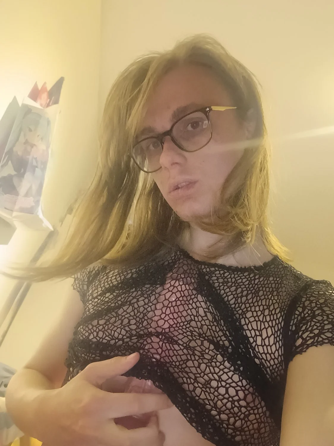 Dutch Kate sucks dildo in fishnet top image 3