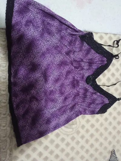 Roupa que minha mãe coloca por baixo do roupão para dormir cover image