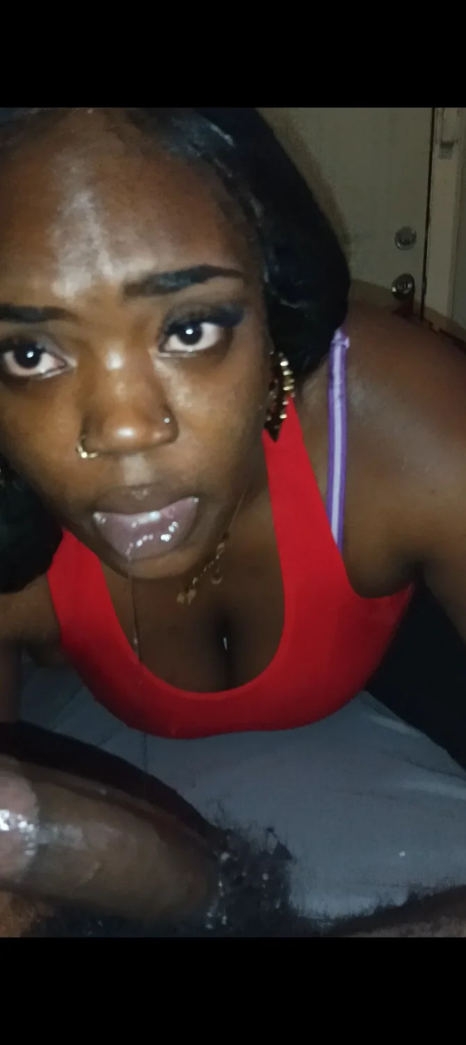 Thick ebony thot sucking nut out of a fat dick image 2