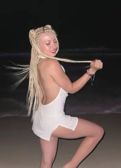 A playful goddess, glowing under the night sky cover image