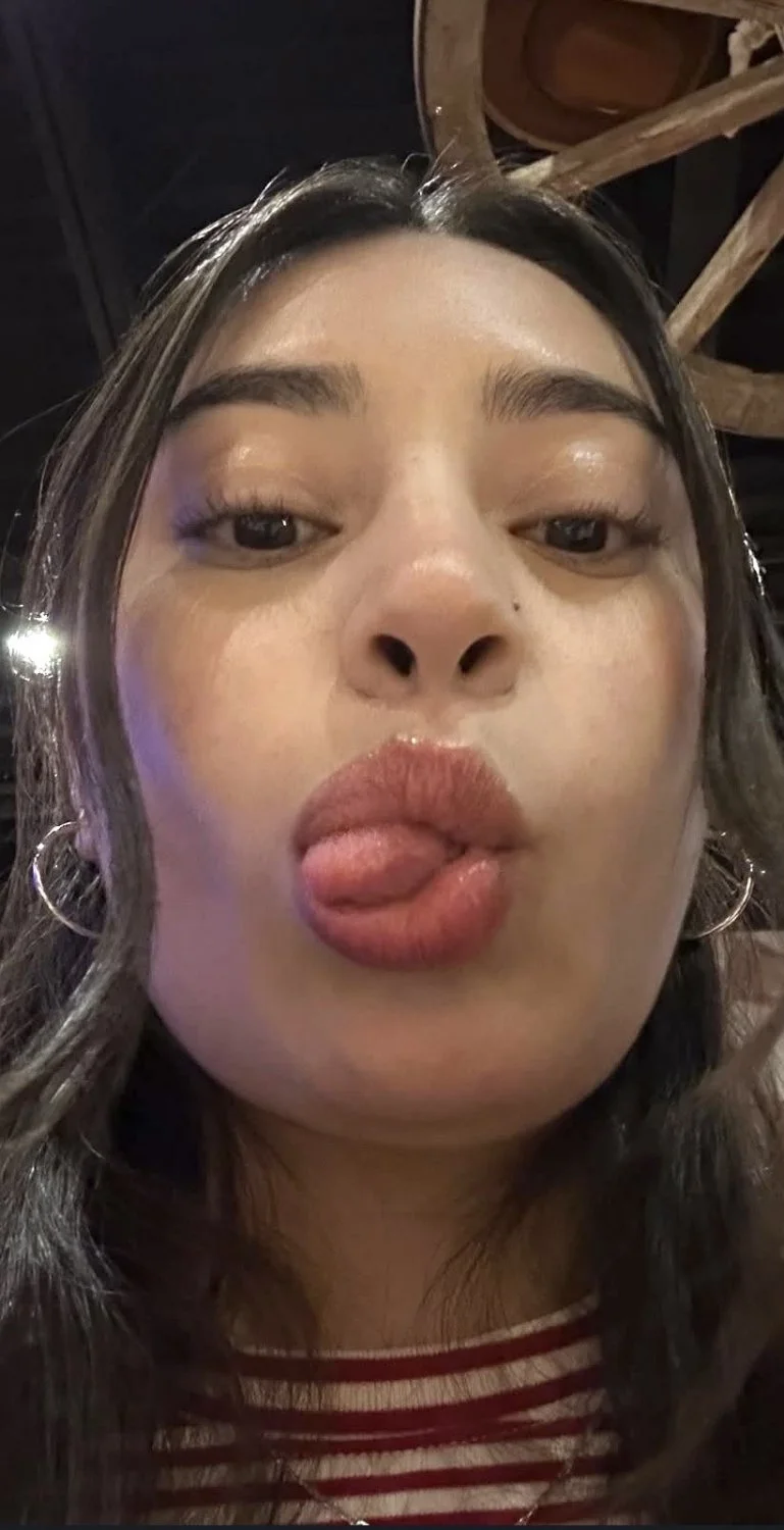 pretty face latina showing off titties main image