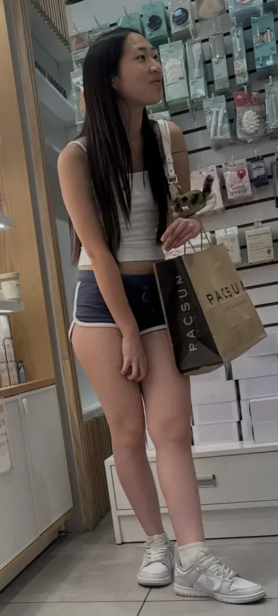 Creeping on asian teen in mini short cover image