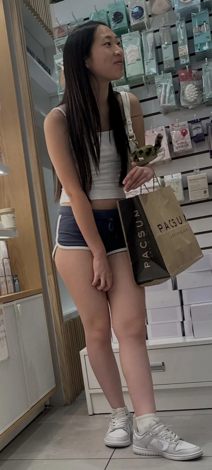 Creeping on asian teen in mini short main image