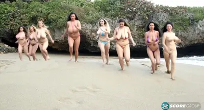 Naked girls with big tits having fun on the beach cover image