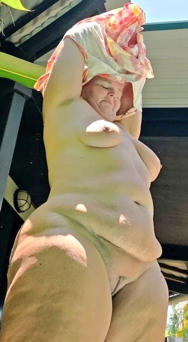 Chubby mature naturist image 10
