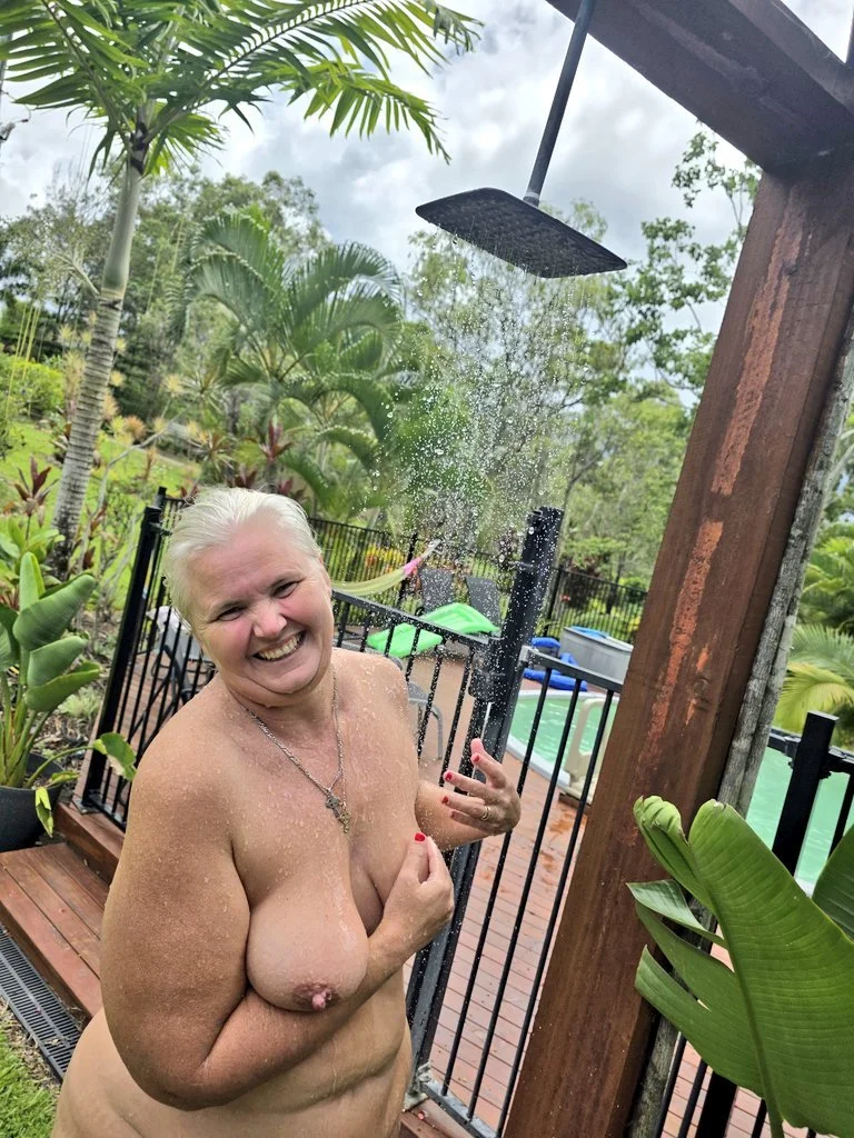 Chubby mature naturist image 11