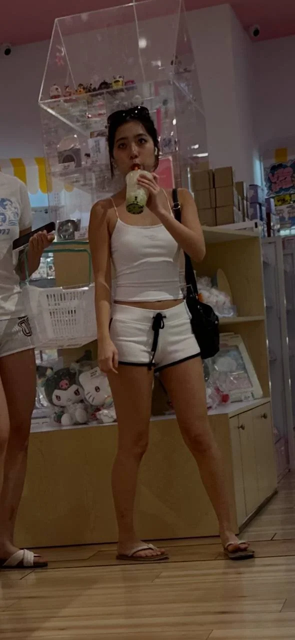 Creeping on hot Asian in shorts image 21