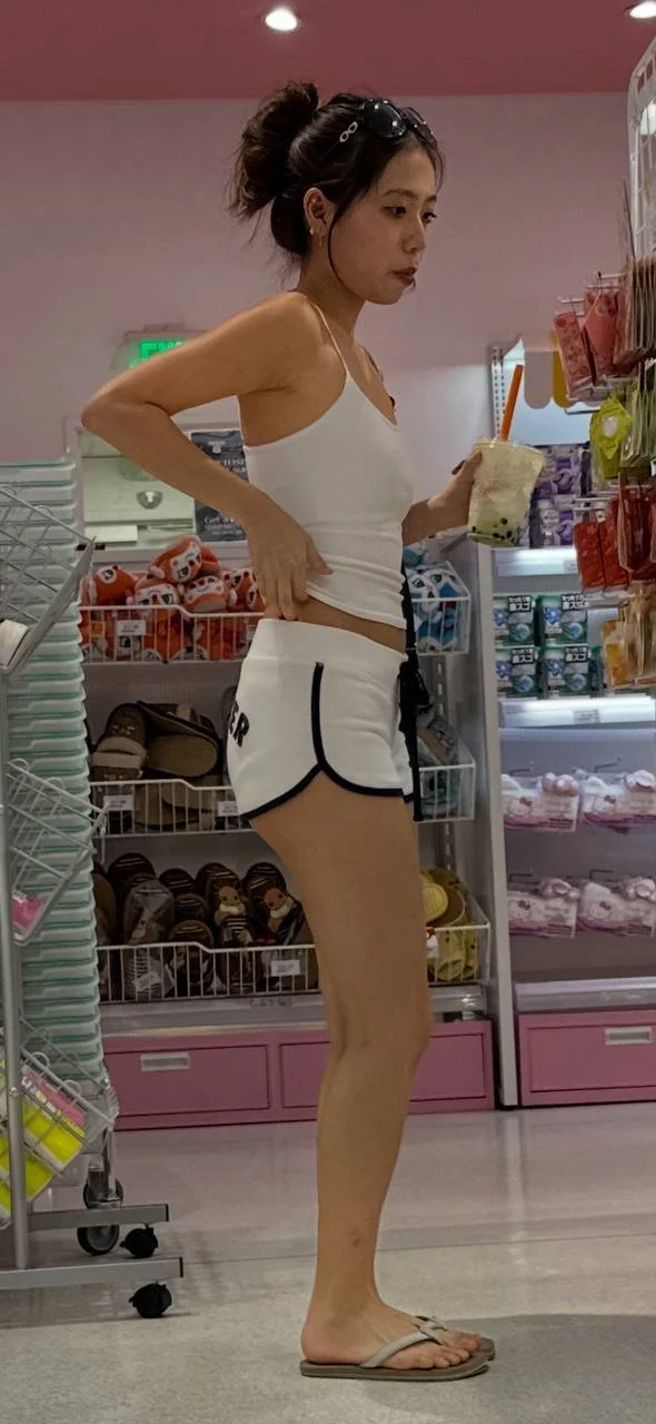 Creeping on hot Asian in shorts image 4