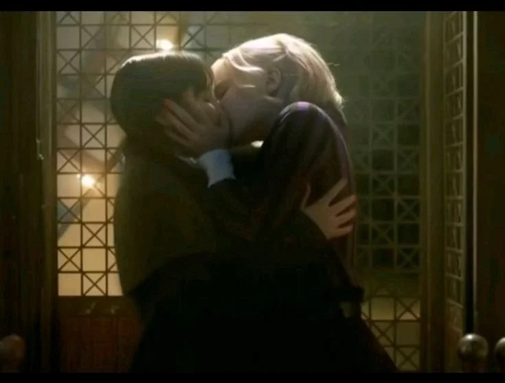 Wednesday Addams and Enid Sinclair kiss main image